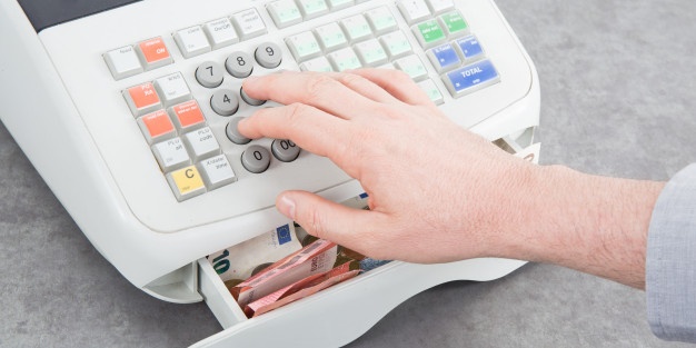 nearly empty cash register table from top view with man hands 100800 1096