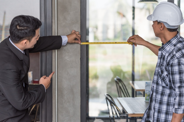employer foreman measuring glass window site 55877 844