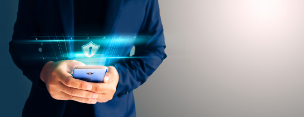 close up business man formal blue suit use hold smart phone dark copy space use finger print unlock smart phone security 44282 15